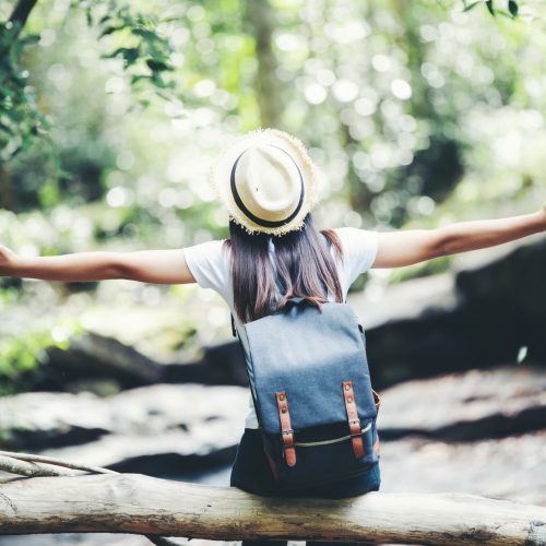 Lifestyle beautiful woman happy torist to travel in wild trip hiking during vacation.Travel Concept.